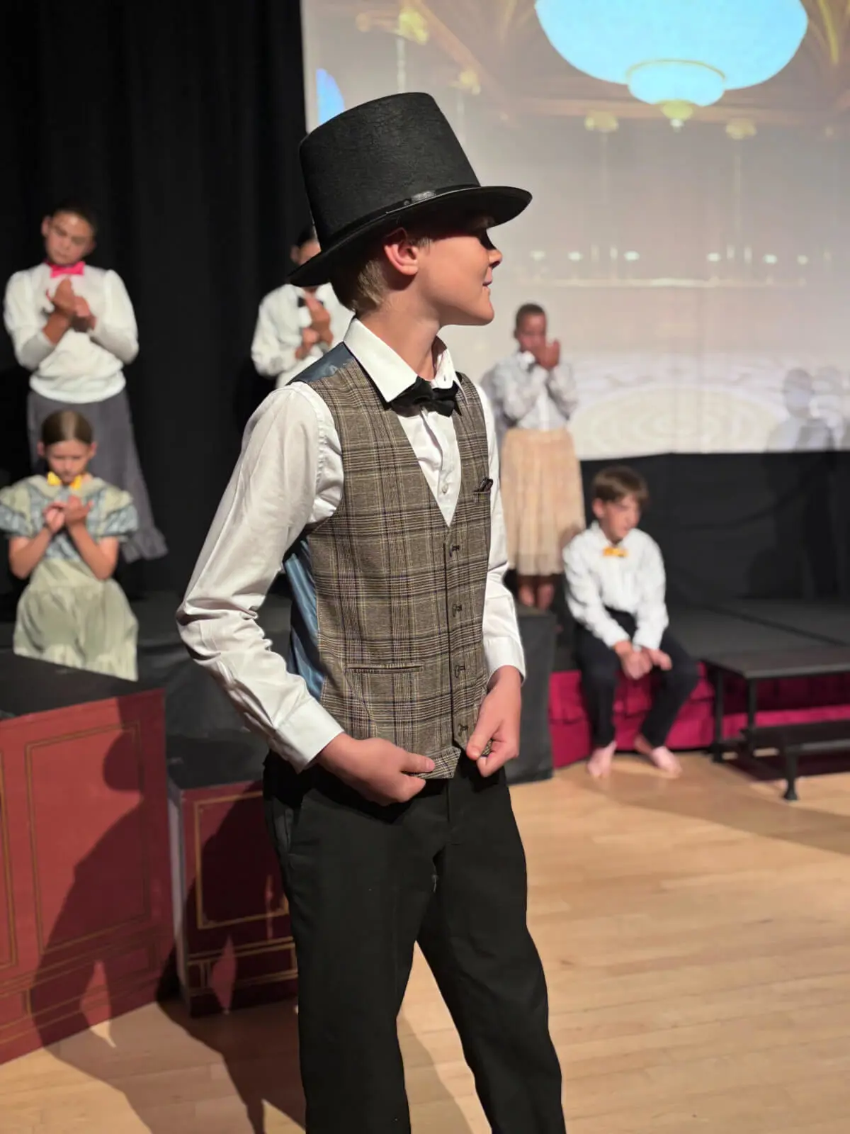 Pupils performing on stage in our Mary Poppins production at Brooke Priory School, a private school in Rutland