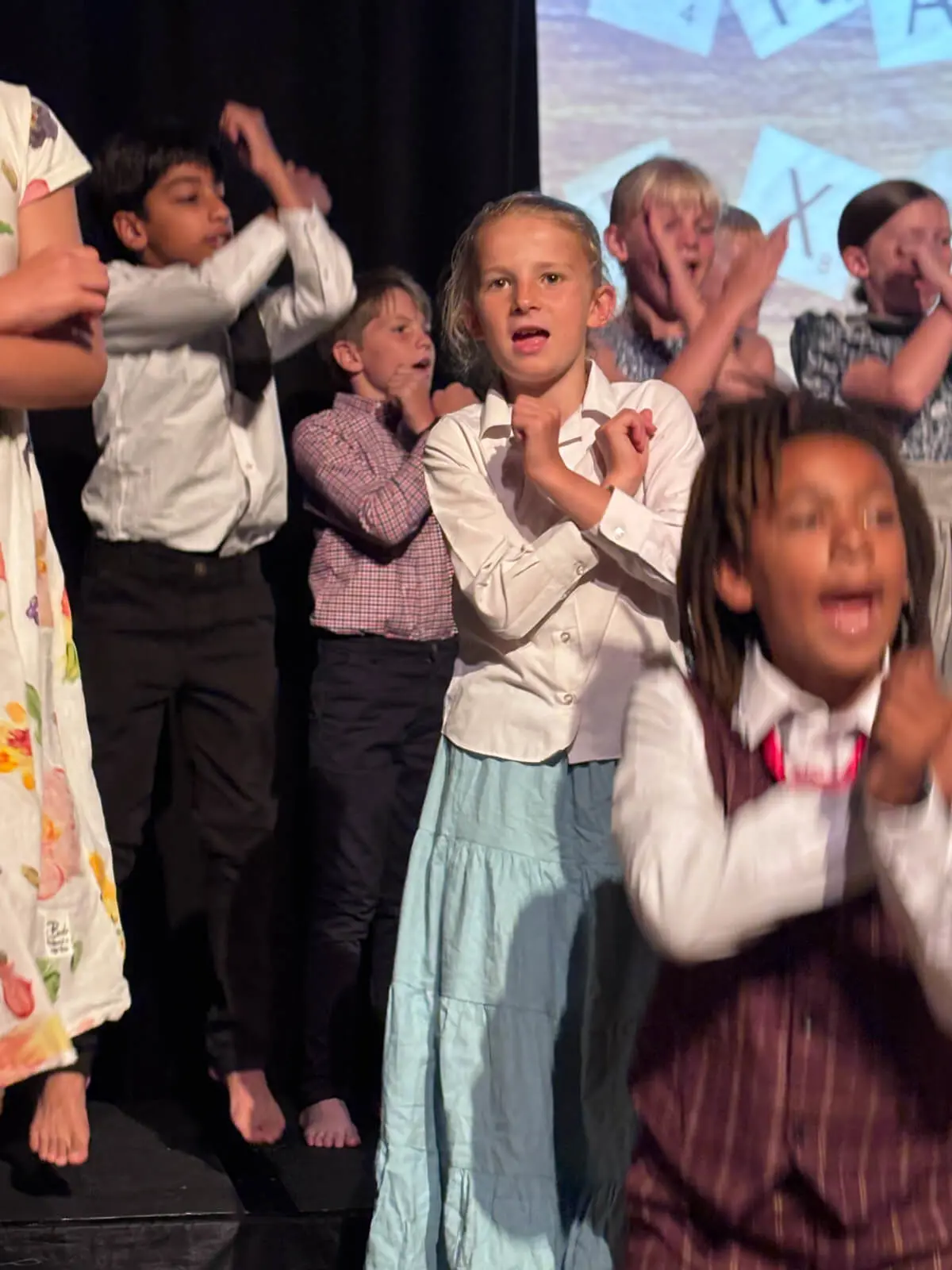 Pupils performing on stage in our Mary Poppins production at Brooke Priory School, a private school in Rutland